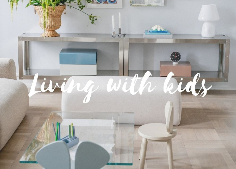 Modern living room with furniture and decor, text 'Living with kids' overlayed.