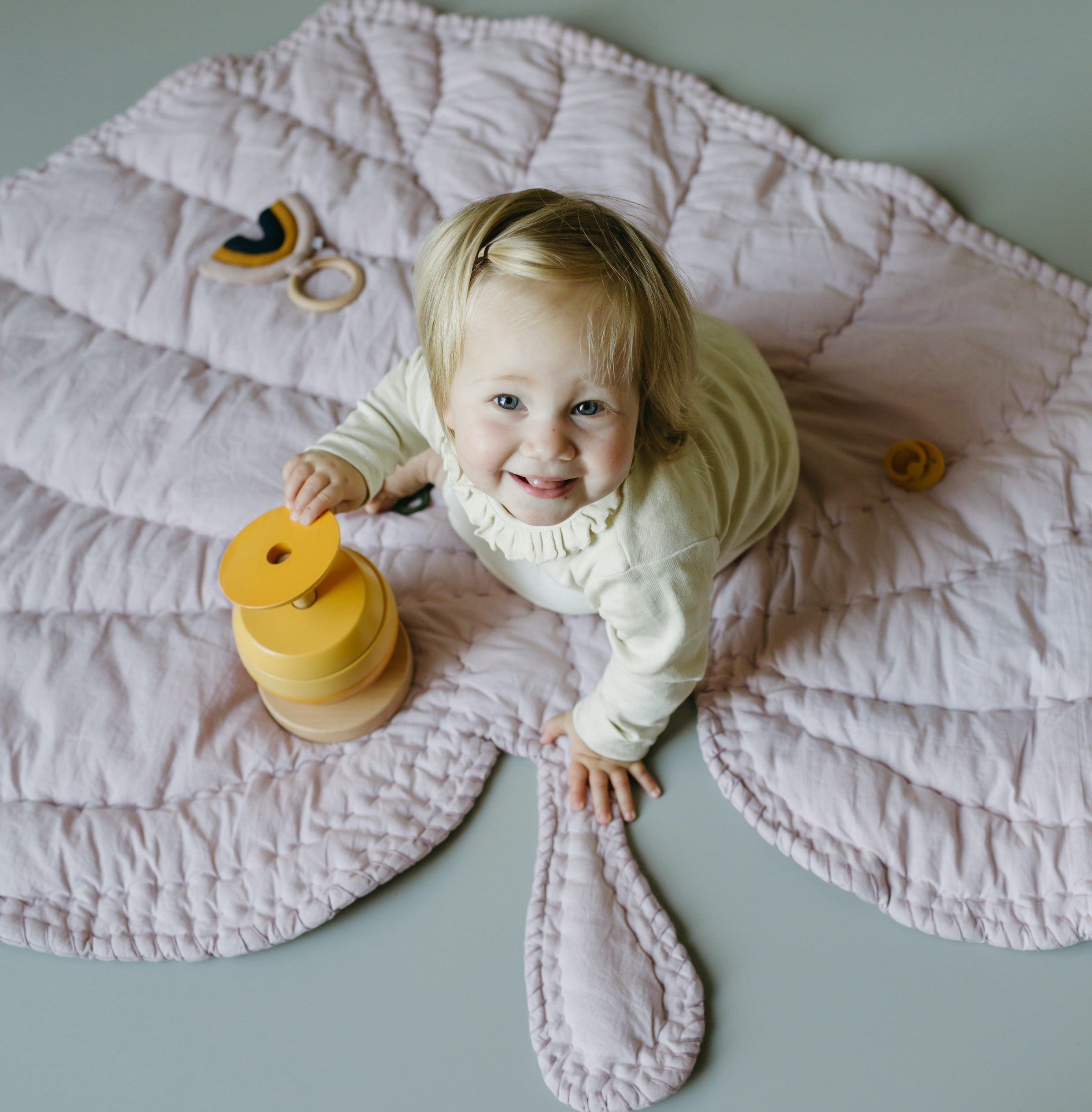 Nofred Lilac Leaf Blanket with a happy kid on it