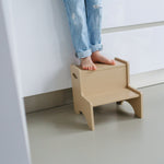 Child standing on Nofred Beige Step Up Stool