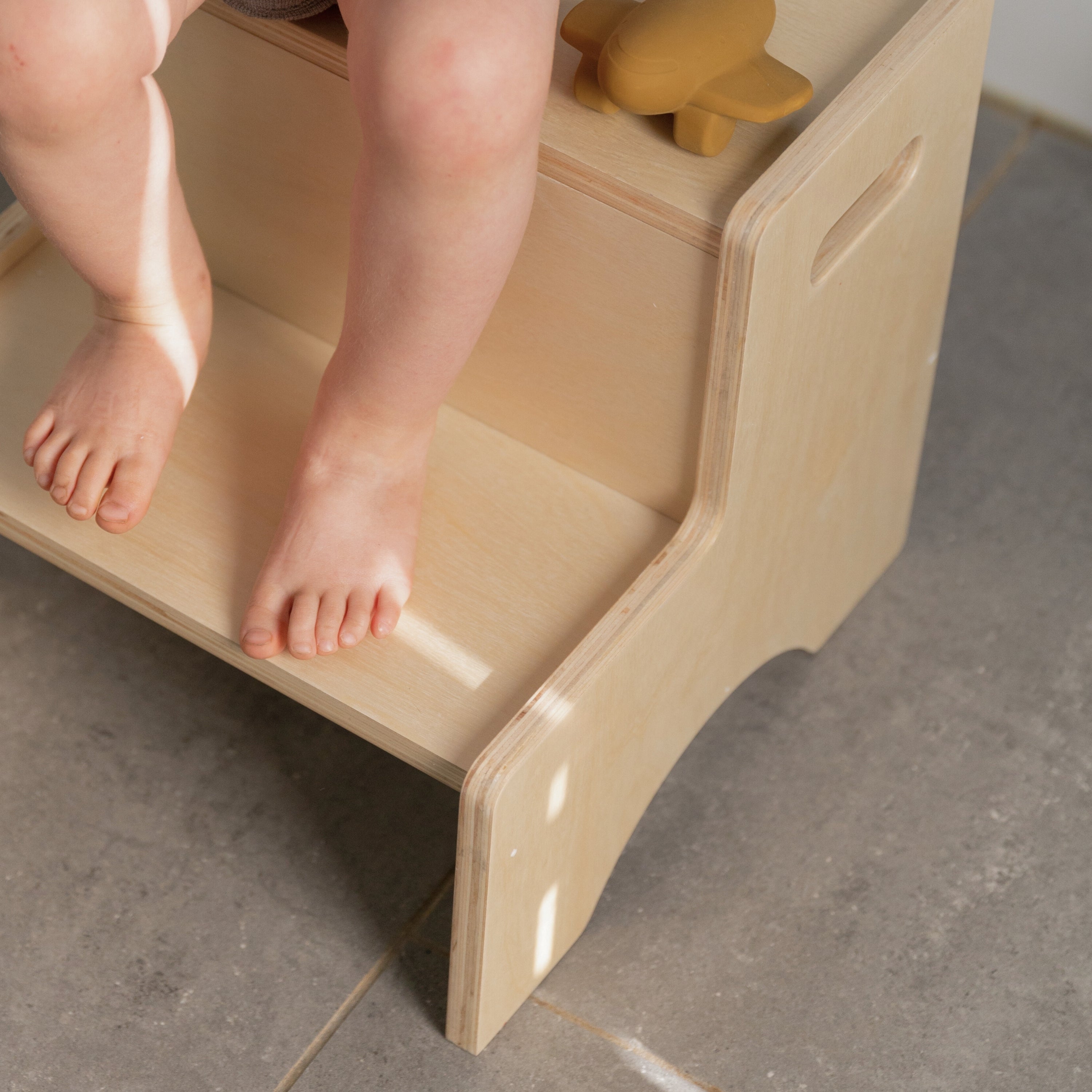 Child standing on Nofred Birch Step Up Stool