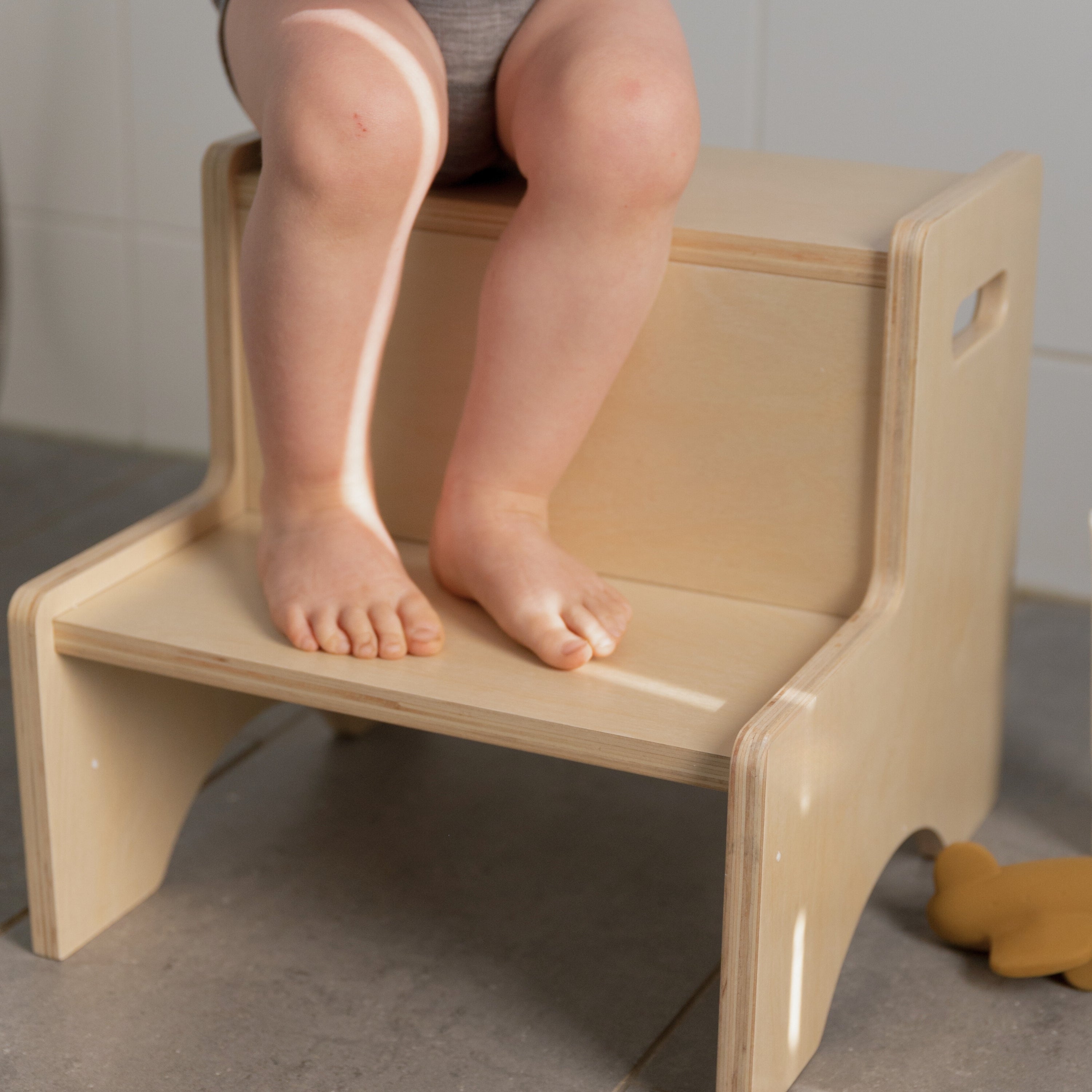Child standing on Nofred Birch Step Up Stool