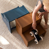 Child playing on Nofred Brown Step Up Stool