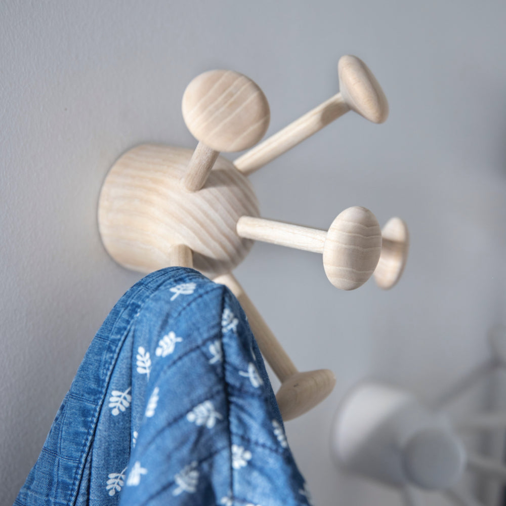 clothes hanging on the Nofred Ash Bug Wall Hook