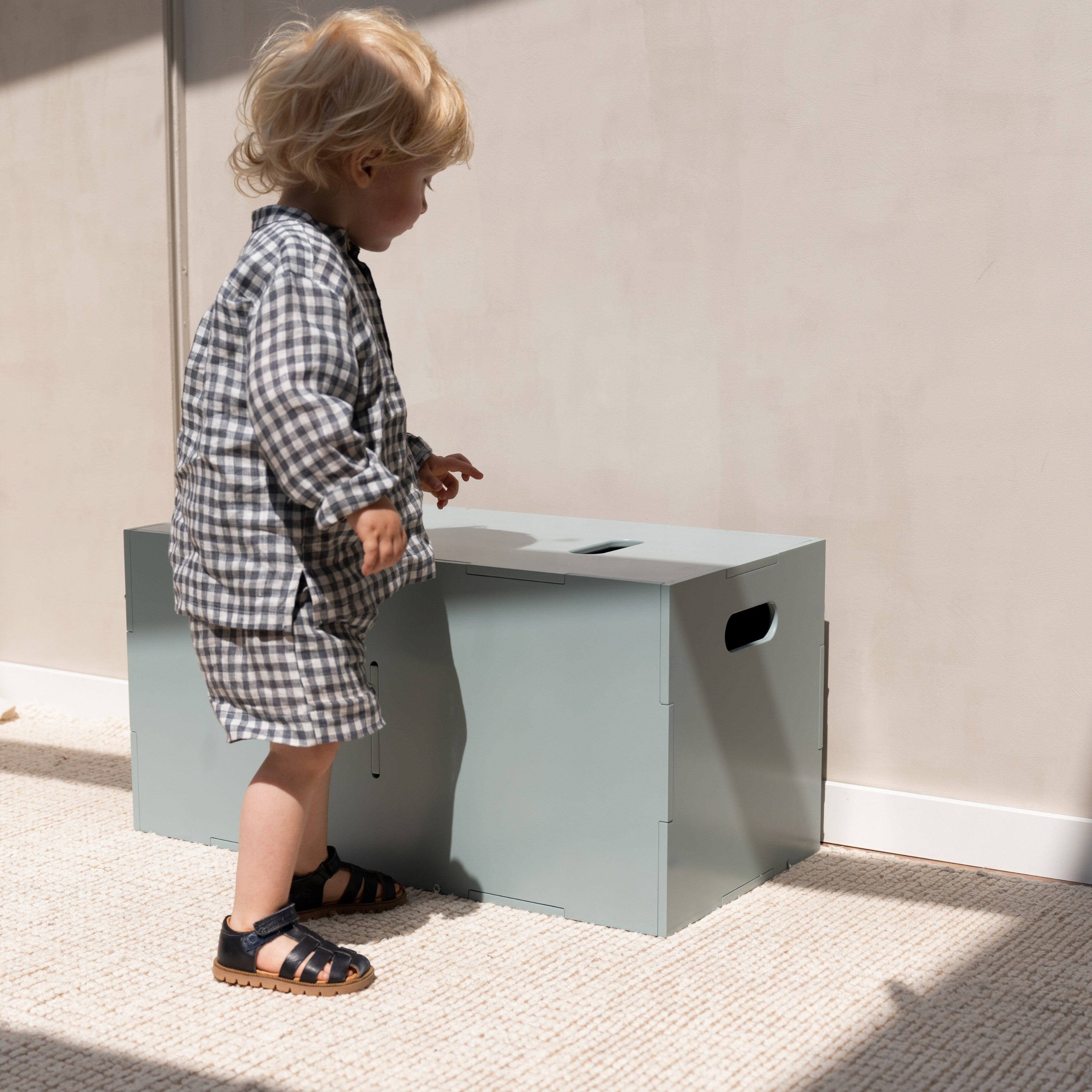 Nofred Olive Green Cube Long Storage with a child nearby