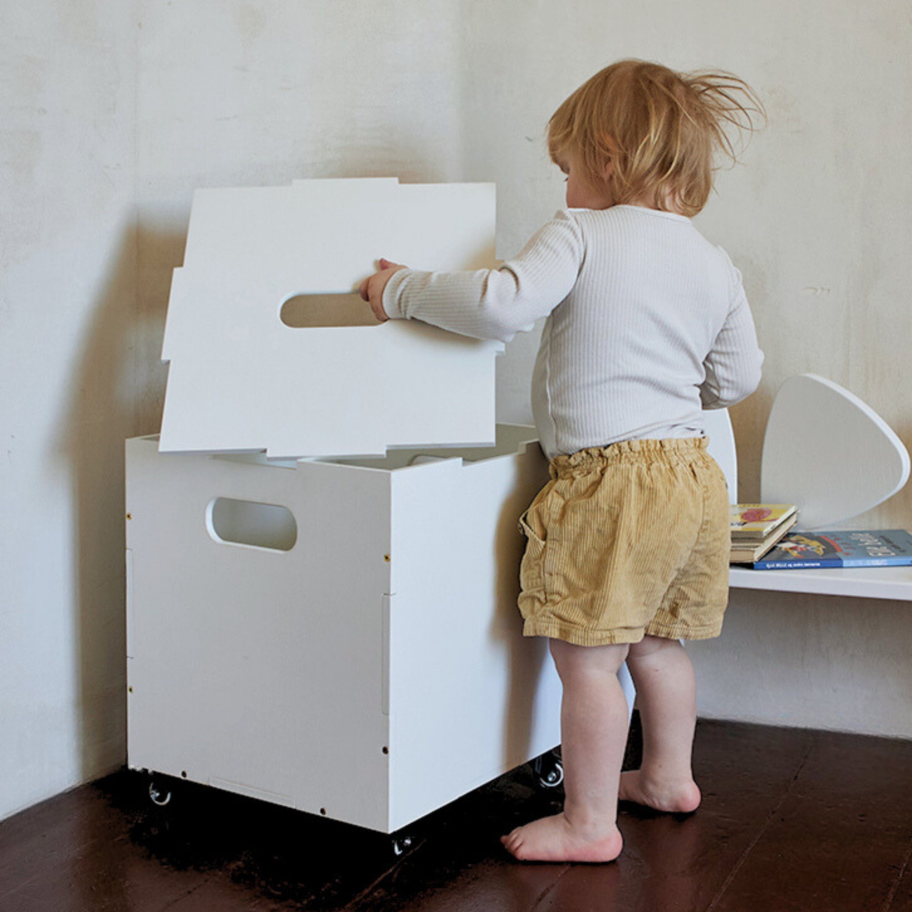 Nofred White Cube Storage and a kid
