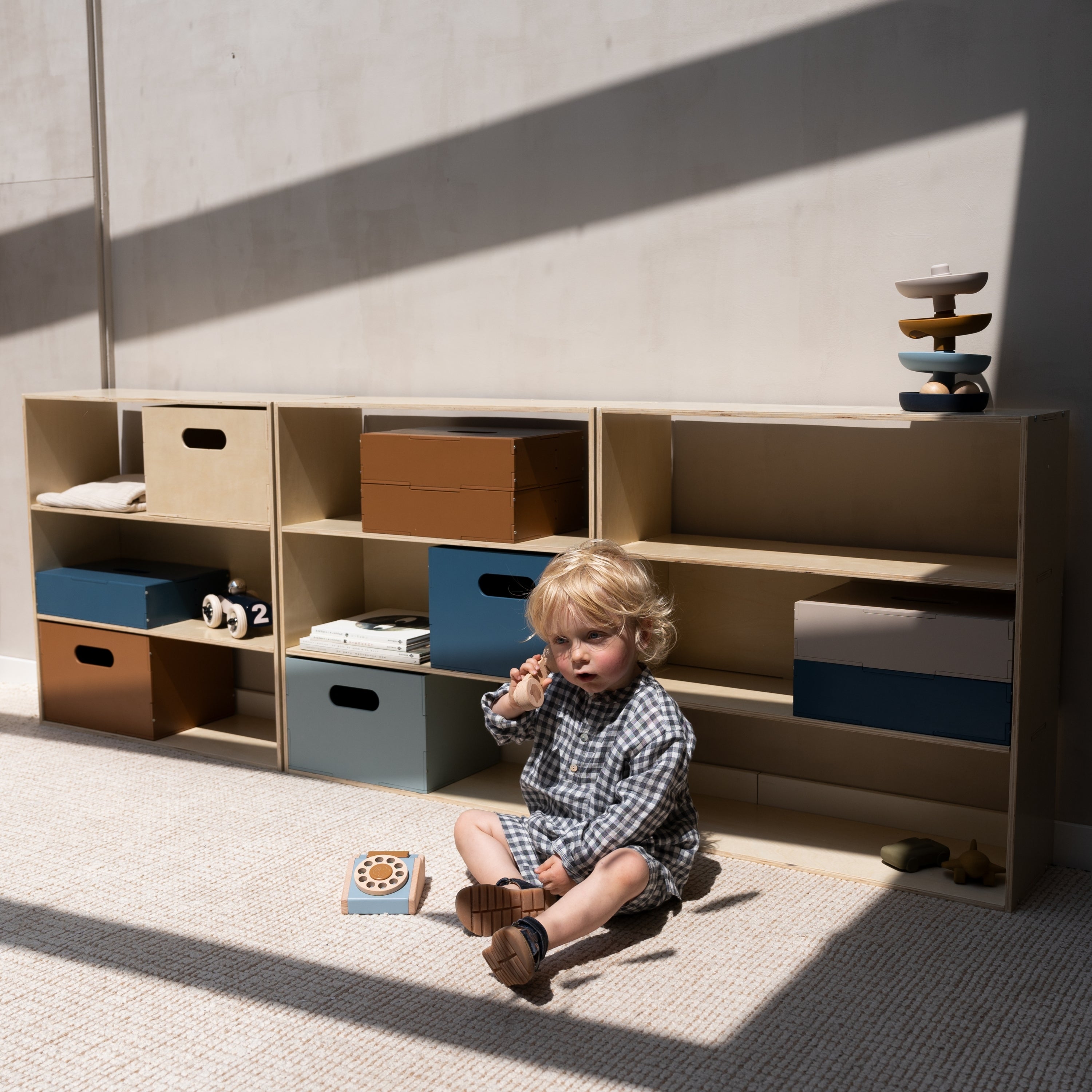 Nofred Birch Kiddo Shelving with a kid in the front
