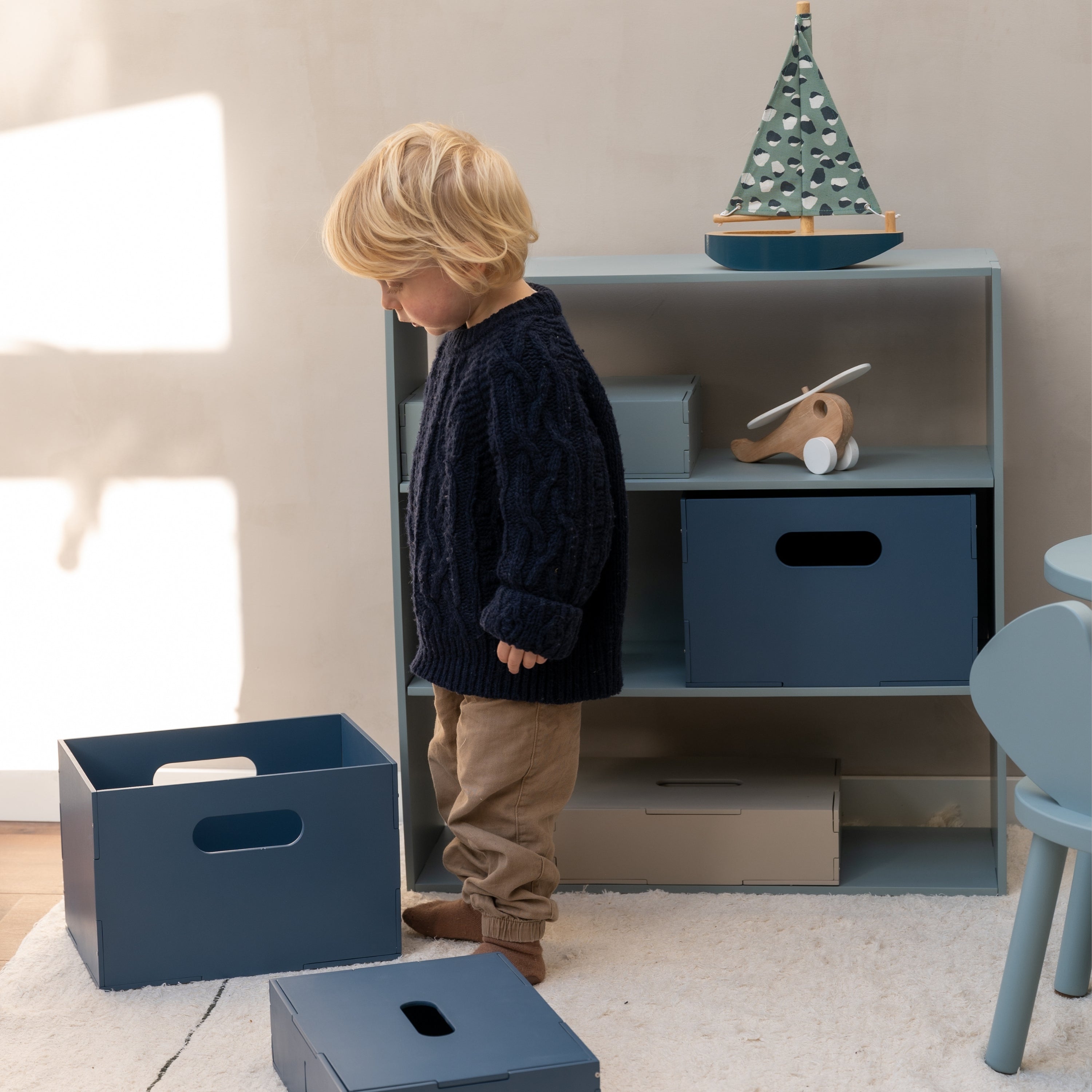 Nofred Olive Green Kiddo Shelving with a kid in the front