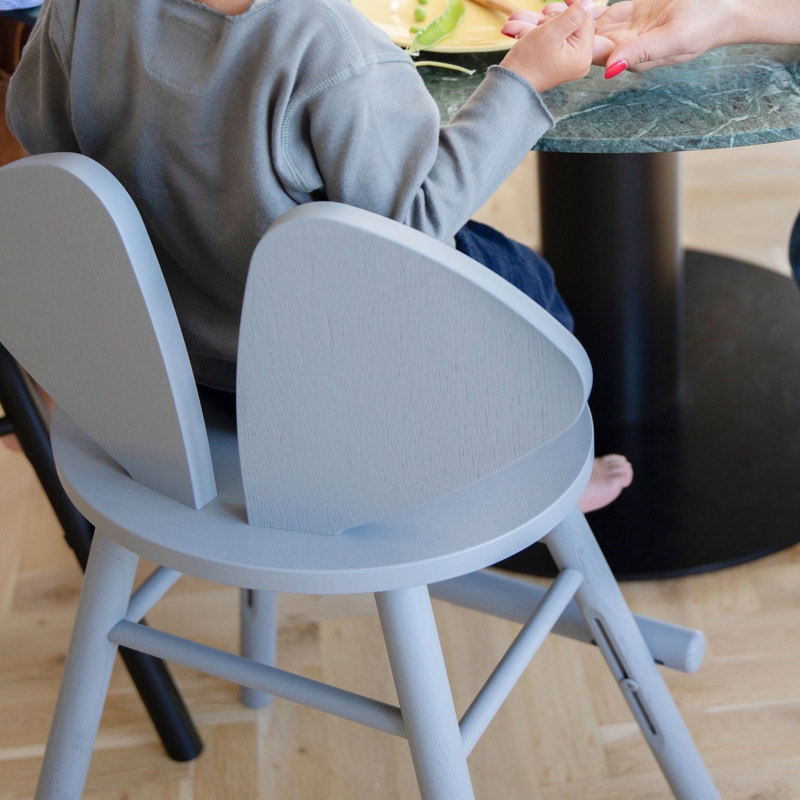 Nofred Grey Mouse Chair Junior with a kid sitting on it