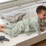 Nofred Bed Baby & Jr. Mattress with a child on it