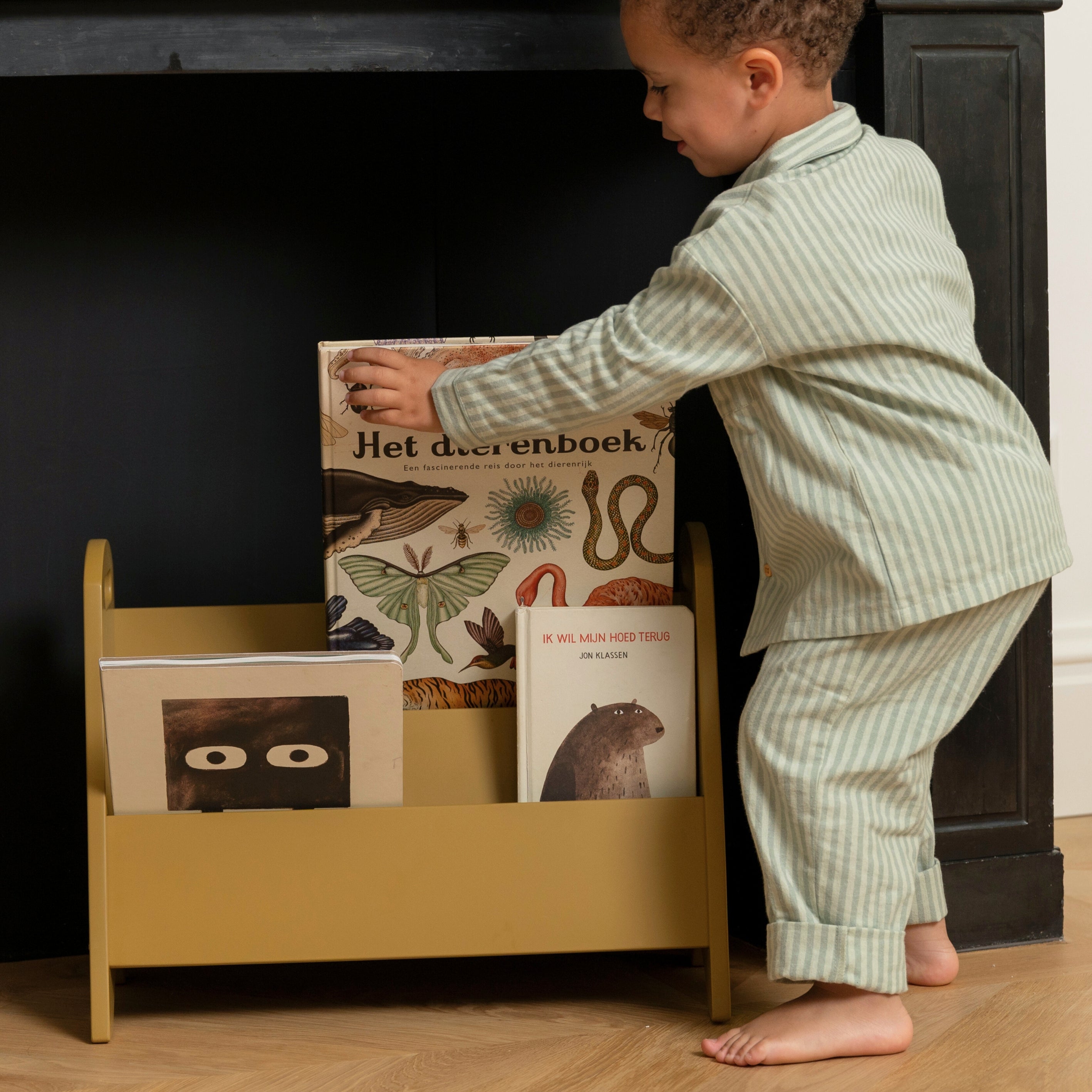 Nofred Curry Bookholder with a child next to it