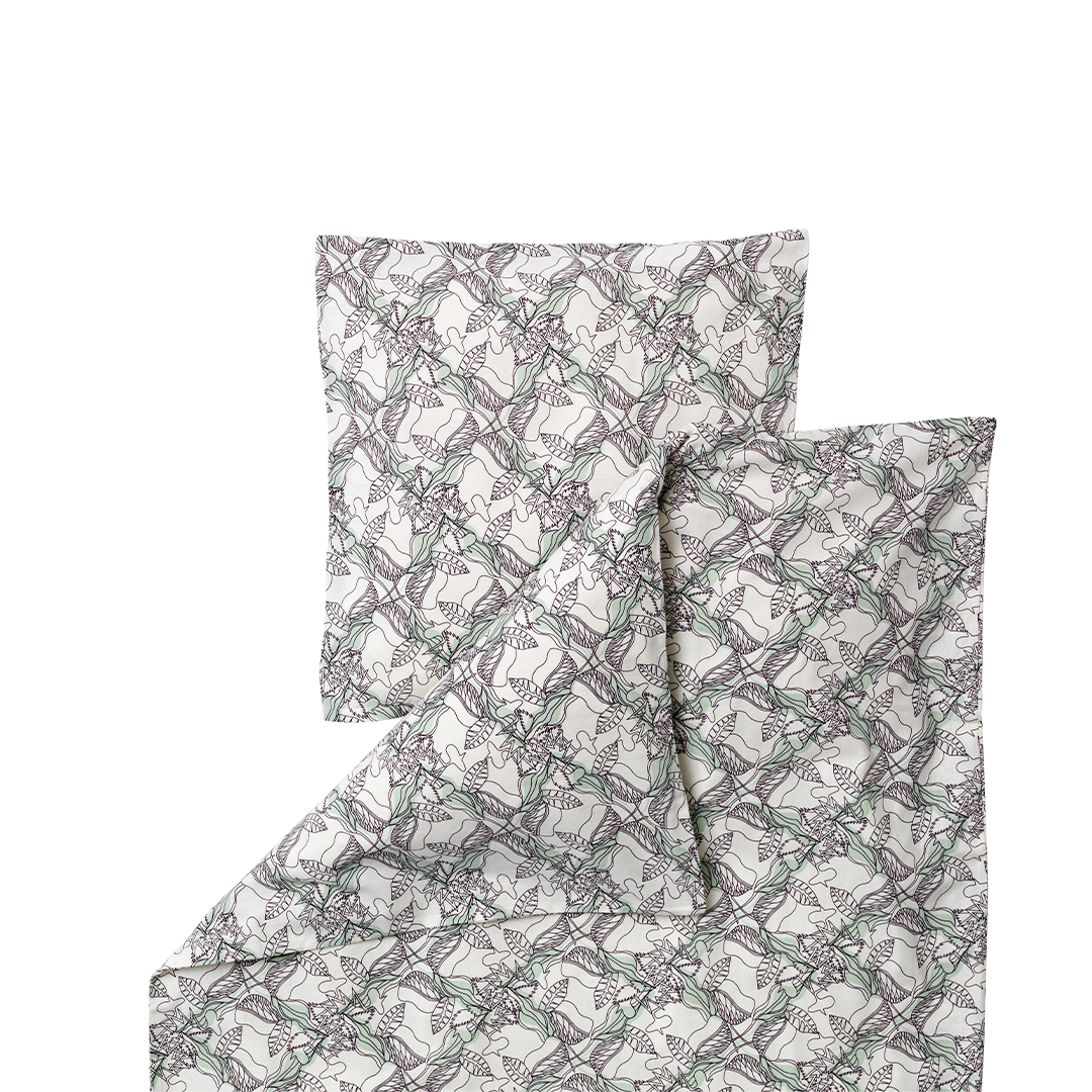 A folded bedding set featuring a duvet cover and pillowcase with an all-over repeating pattern of gray and muted green leafy vines on a warm off-white background.