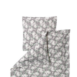 A folded bedding set featuring a duvet cover and pillowcase with an all-over repeating pattern of gray and muted green leafy vines on a warm off-white background.