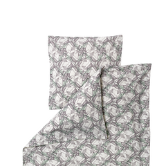 A folded bedding set featuring a duvet cover and pillowcase with an all-over repeating pattern of gray and muted green leafy vines on a warm off-white background.