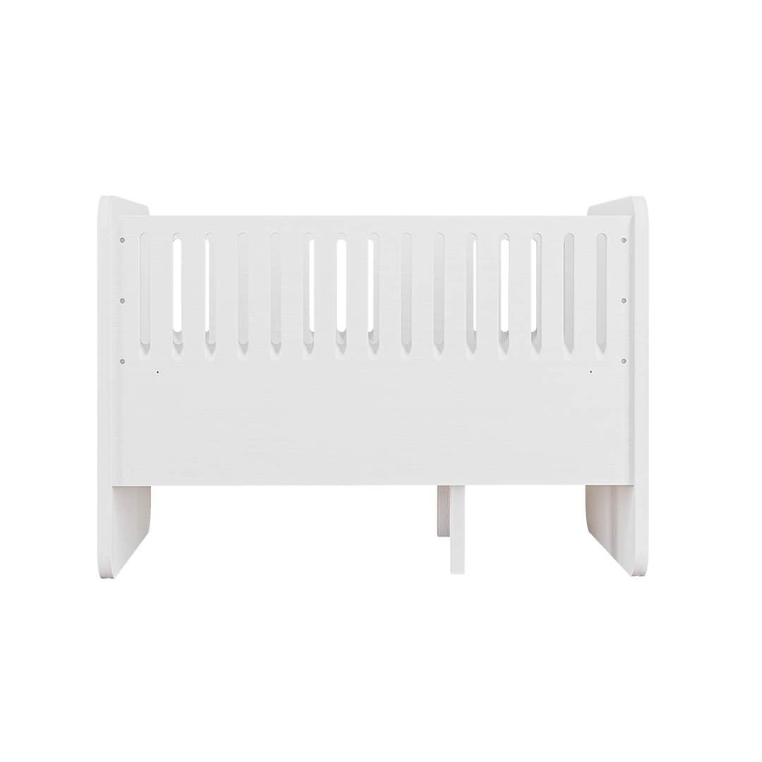 A white wooden toddler bed with vertical safety slats, shown from a front three-quarter angle against a solid white background.