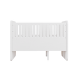 A white wooden toddler bed with vertical safety slats, shown from a front three-quarter angle against a solid white background.