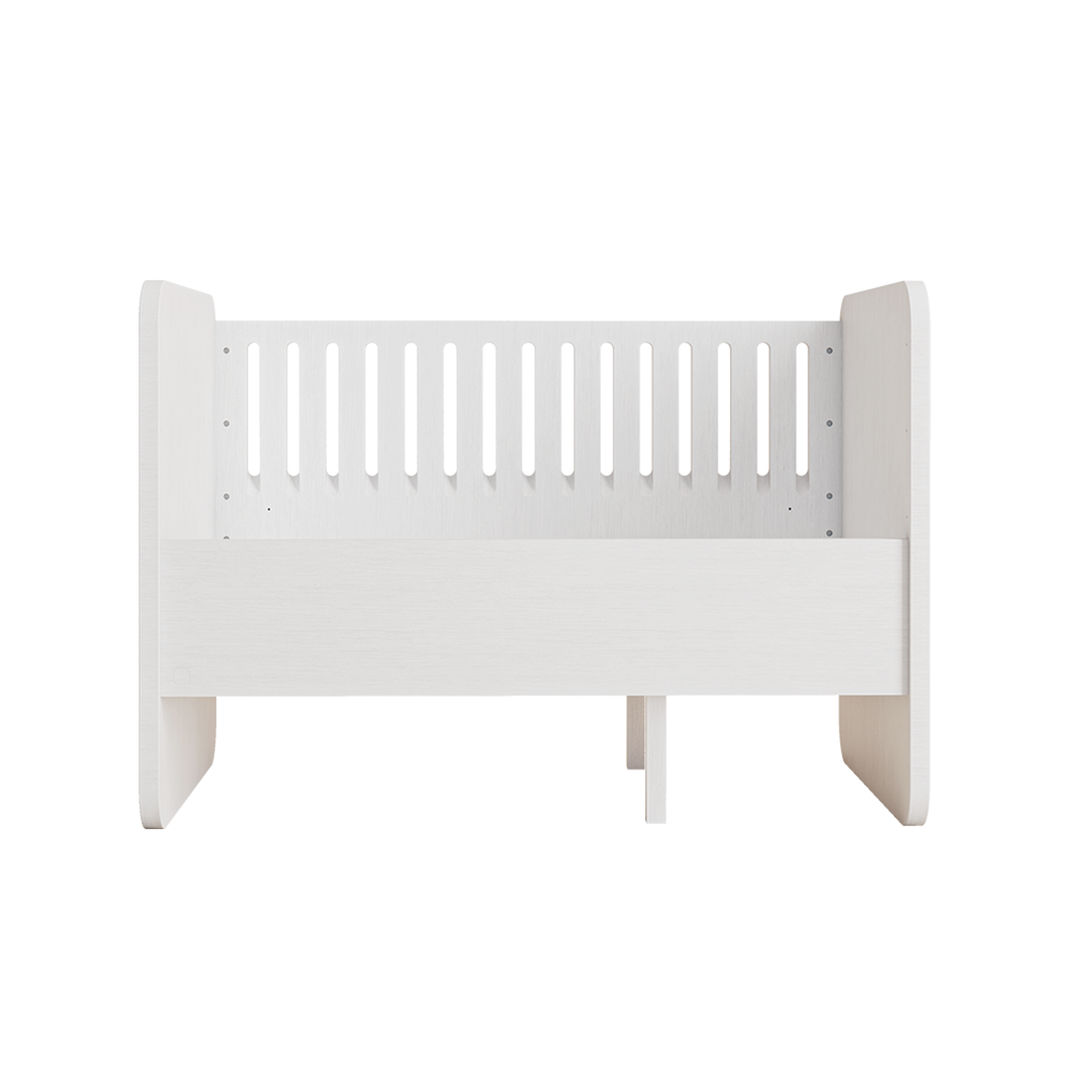 A white wooden toddler bed with a slatted backrest and solid side panels, shown from a front angle on a plain white background.