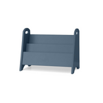 A three-step wooden magazine rack in a muted slate blue color, shown from a three-quarter angle on a clean white background.