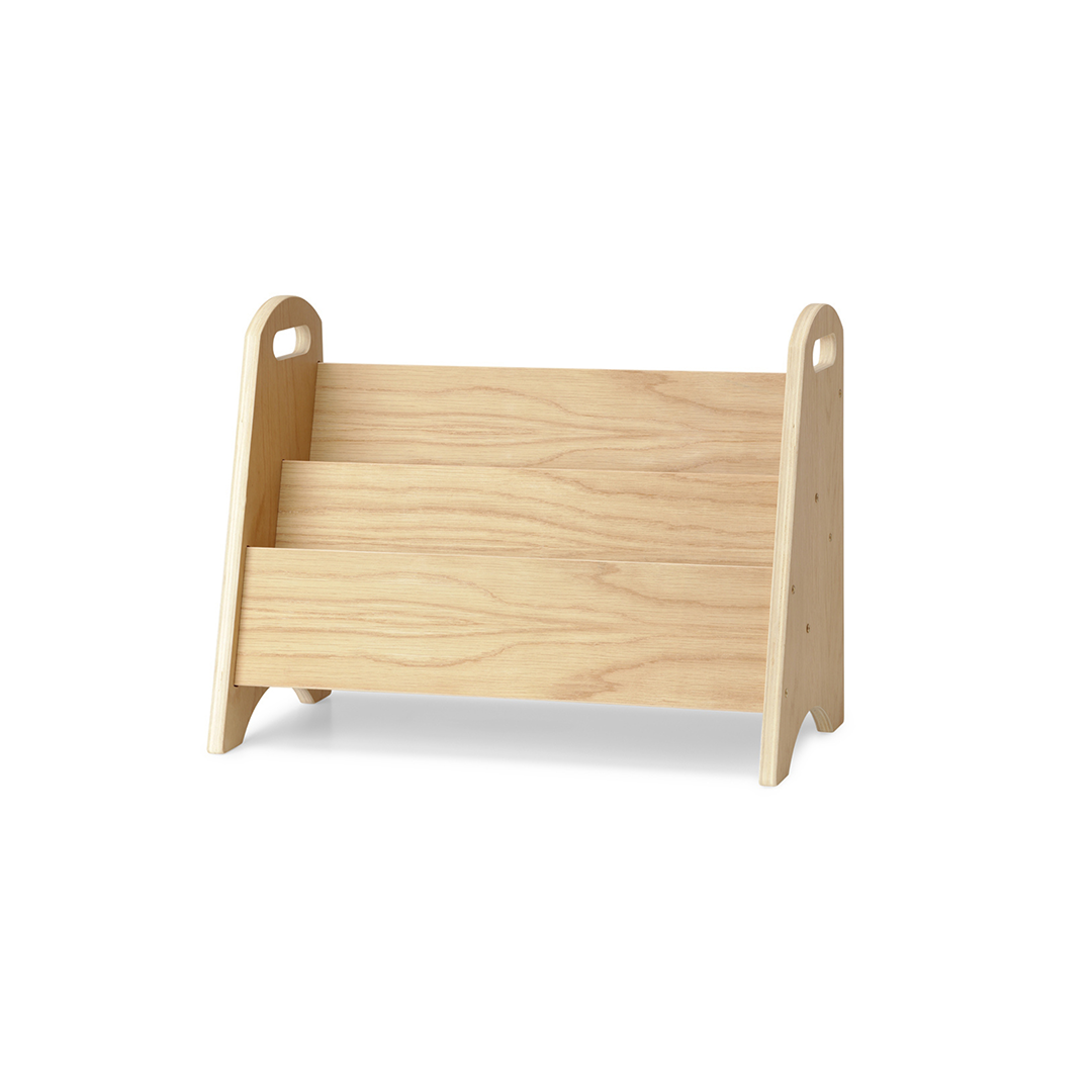 A light natural wood magazine rack with three open shelves and rounded side handles, shown on a clean white background.