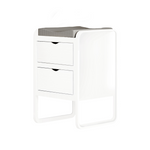 A modern white changing table or bedside cabinet with two drawers and a gray mesh changing pad on top, shown on a plain white background.