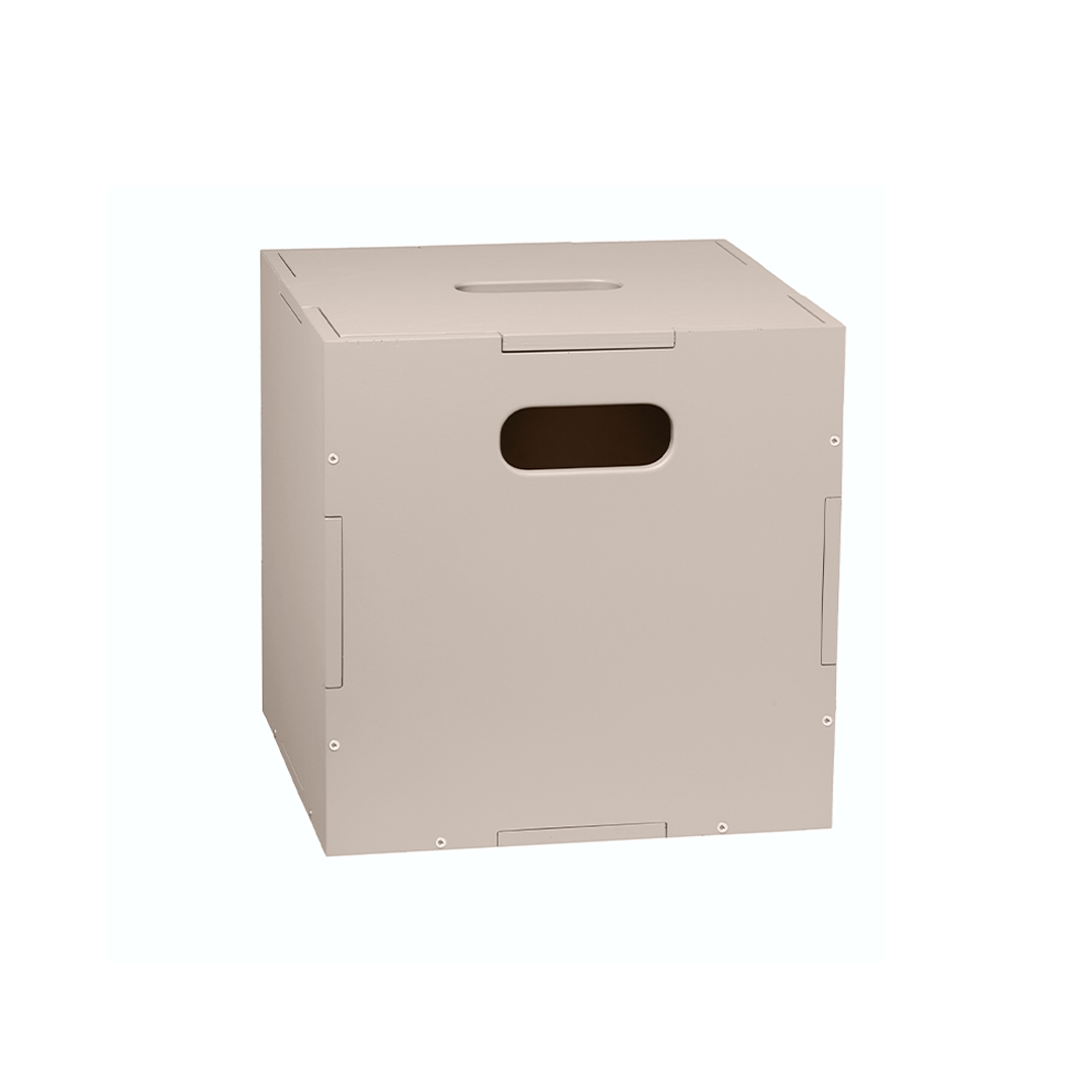 A light beige cardboard shipping box with a rectangular cutout handle on the front, shown on a plain white background.