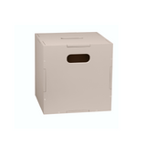 A light beige cardboard shipping box with a rectangular cutout handle on the front, shown on a plain white background.