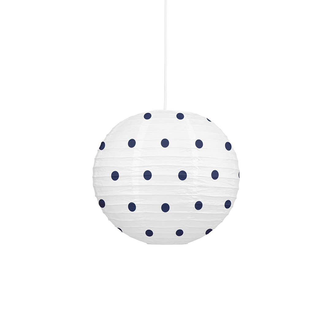 A white spherical paper lantern pendant light with dark navy blue polka dots, suspended by a thin white cord against a solid white background.