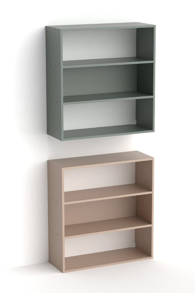 Two three-tier open bookcases shown against a plain white background, one in muted gray-green and one in light natural wood.