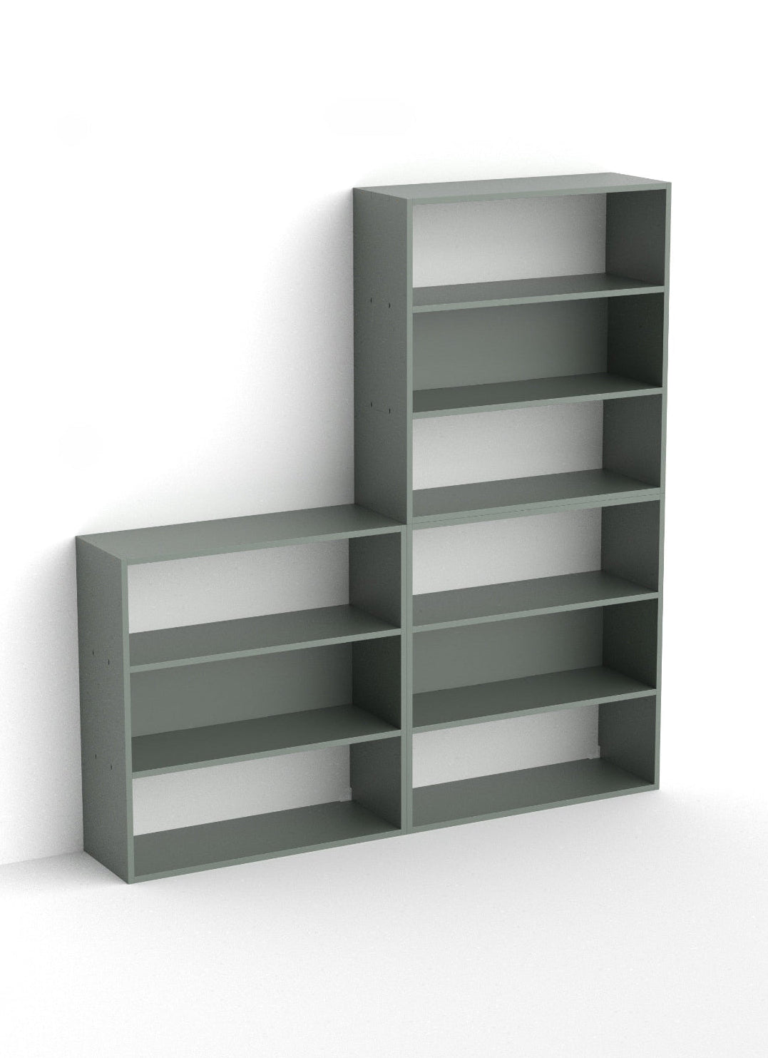 A modern L-shaped bookcase in a muted gray-green color, featuring a tall column of five shelves on the right and four open cubbies on the left, shown against a plain white background.