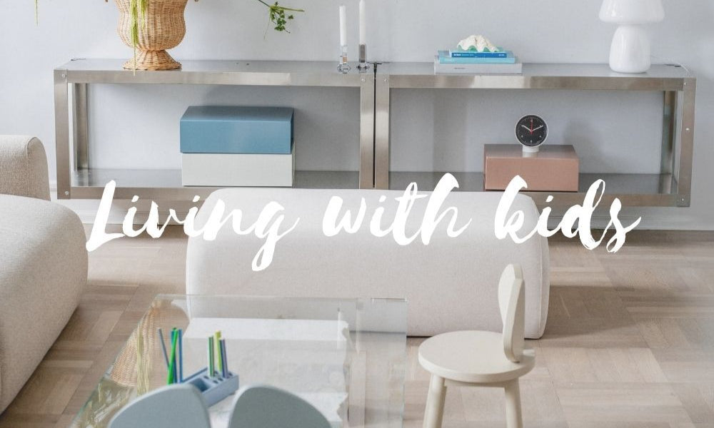 Modern living room with furniture and decor, text 'Living with kids' overlayed.