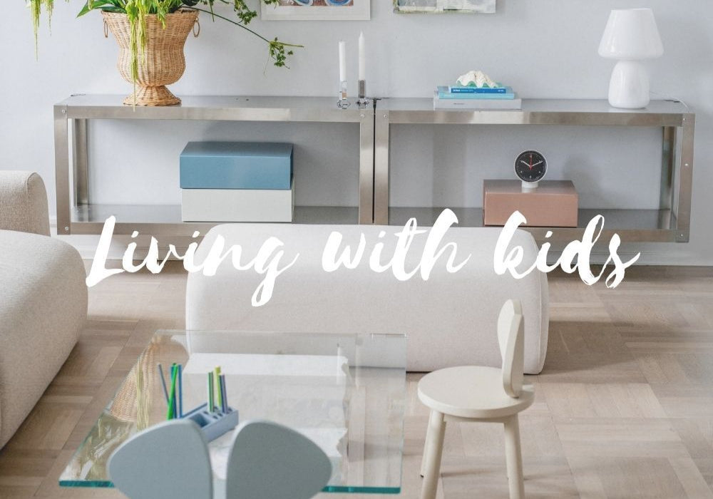 Modern living room with furniture and decor, text 'Living with kids' overlayed.