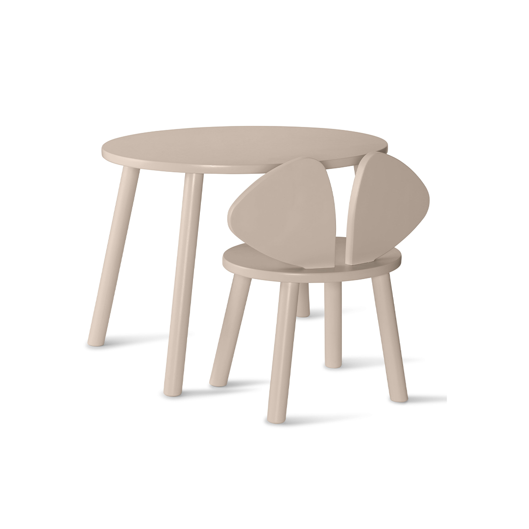 A light beige children's table and chair set on a clean white background. The set includes a round table with tapered legs and a matching chair with a unique double-oval backrest.
