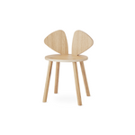 A light natural wood children's chair with a round seat, four tapered legs, and a back made of two curved wing-like panels, shown on a plain white background.