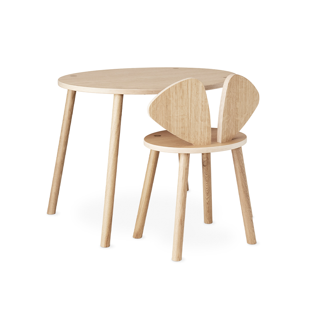 A light natural wood children's table and matching chair with rounded triangular backs, shown on a clean white background.