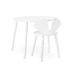 A minimalist white children's table and chair set on a seamless white background. The round table has slim tapered legs, and the matching chair features a unique winged or bunny-ear backrest design.