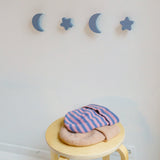 Light blue stars and moons hooks hanging on the wall