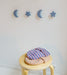 Light blue stars and moons hooks hanging on the wall