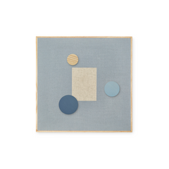 A square abstract wall art piece with a light blue linen-like center, a natural wood frame, a beige rectangular block, and three circular shapes in beige wood, dark blue, and light blue, shown on a white background.
