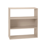 A three-tier wooden bookcase with a light beige finish, shown from a three-quarter angle on a solid white background.