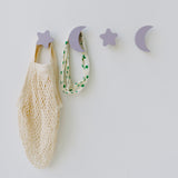 Bag and kids accessories hanging on star and moons hooks