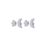 Four light gray stud earrings on a plain white background, including two crescent moon shapes and two starburst shapes.