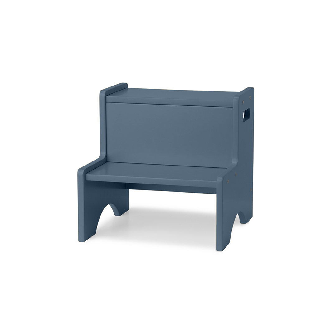 A modern, minimalist wooden step stool bench in a muted slate blue-gray color, shown from a three-quarter angle on a clean white background.