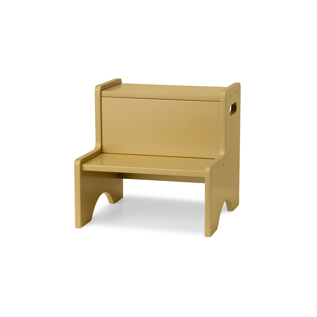 A minimalist wooden bench with a light tan finish, featuring a backrest, seat, and integrated side storage compartment, shown on a plain white background.