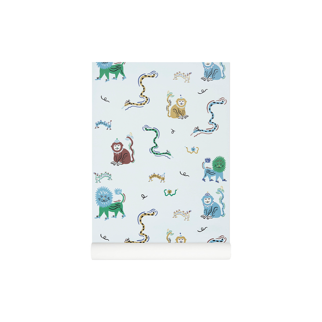 A roll of wallpaper with a light blue background and a whimsical pattern of cartoon animals and abstract shapes in green, blue, brown, yellow, and black.