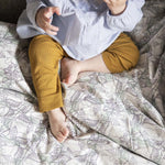 Happy baby on the perfect sheets
