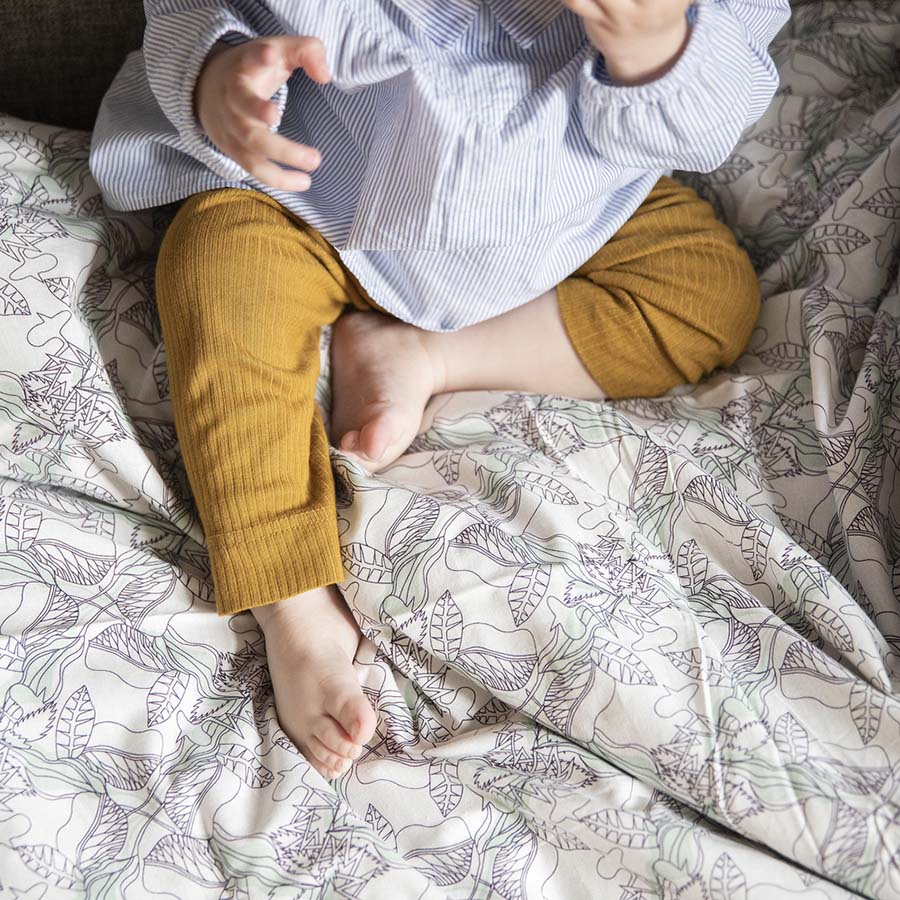 Happy baby on the perfect sheets