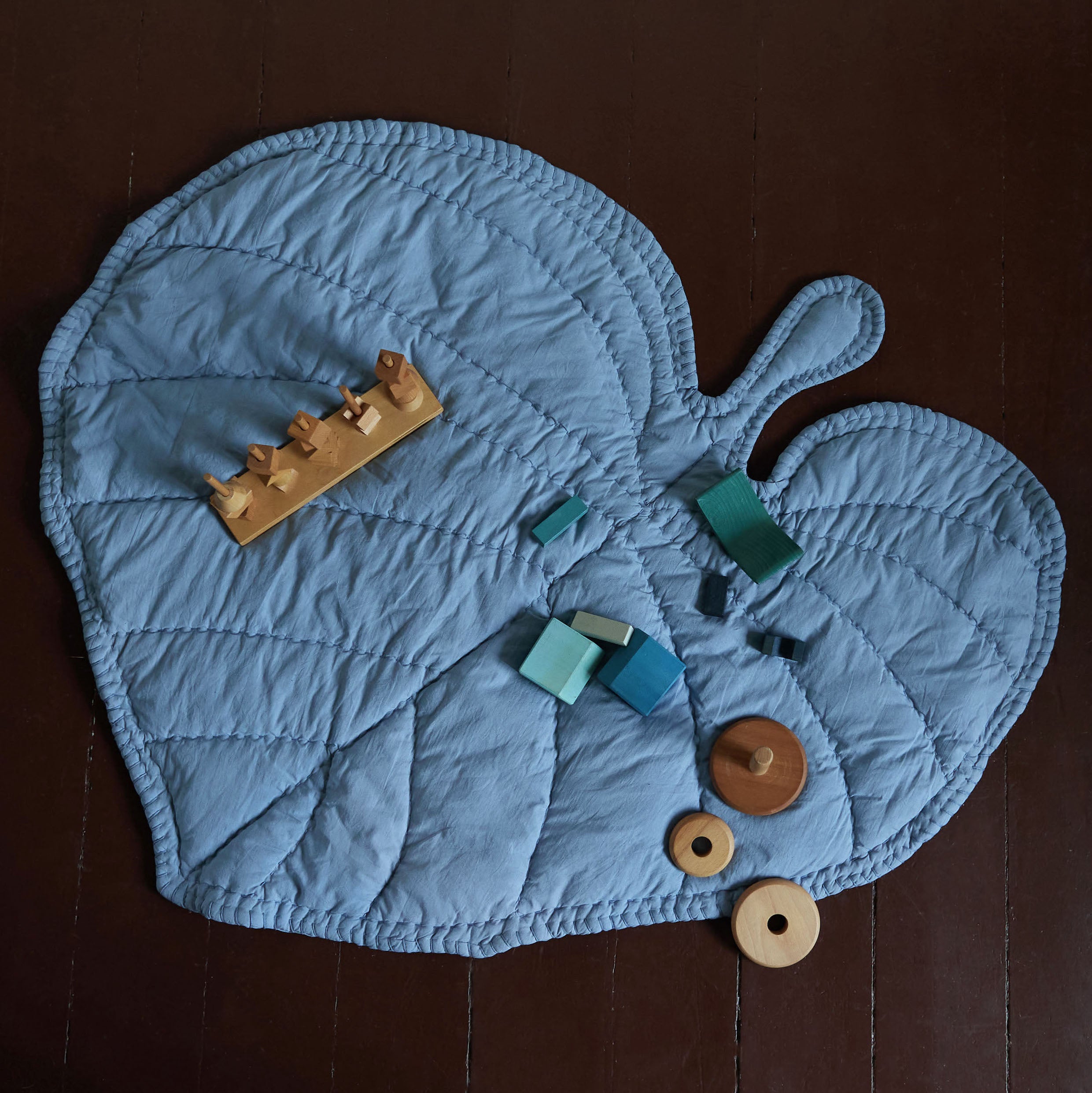 Nofred Blue Leaf Blanket with toys on it