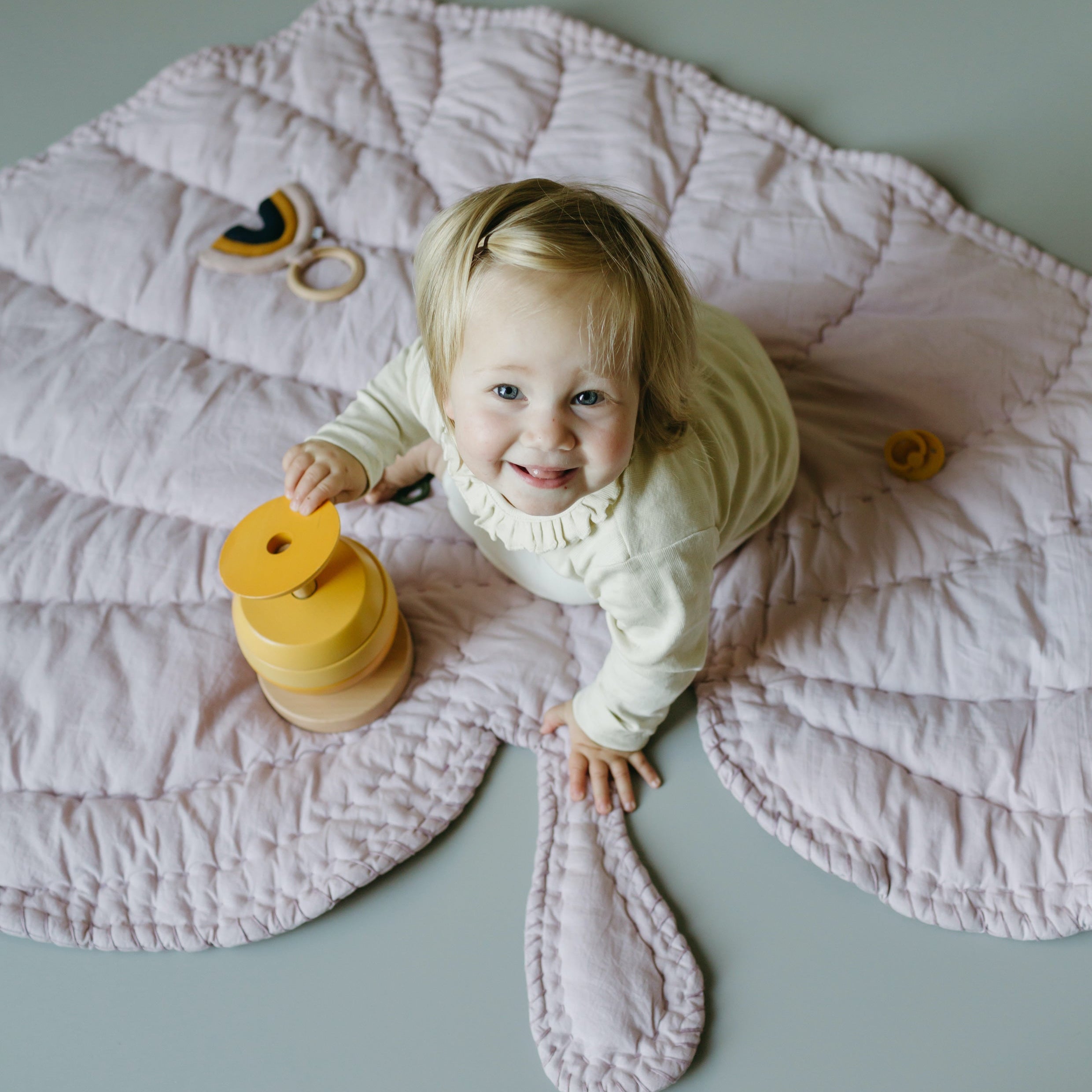 Nofred Lilac Leaf Blanket with a happy kid on it