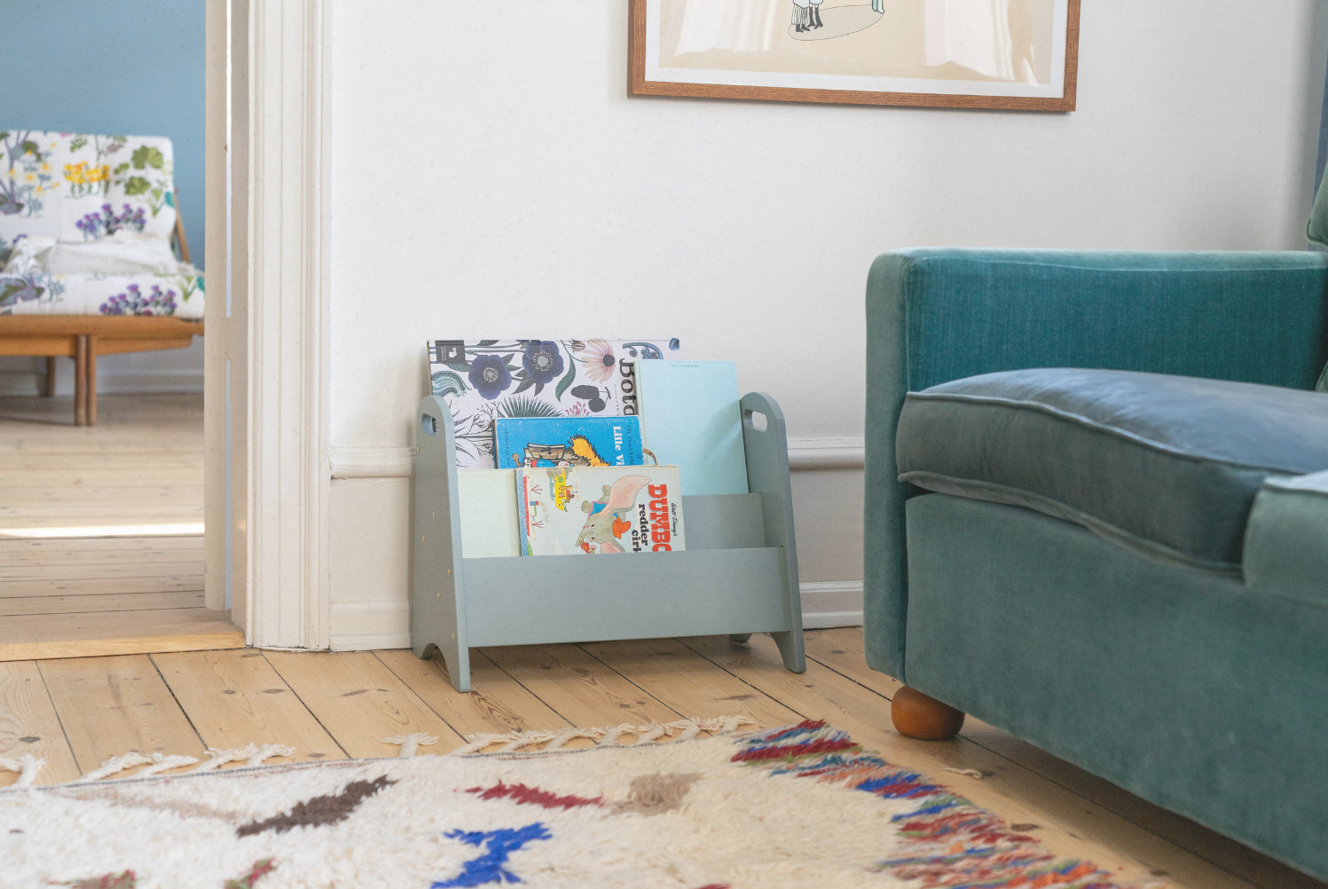 Children's bookshelf with books in a living room setting