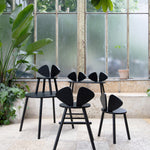 Nofred Black Mouse Chair in the urban scenery