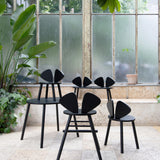 Nofred Black Mouse Chair in the urban scenery